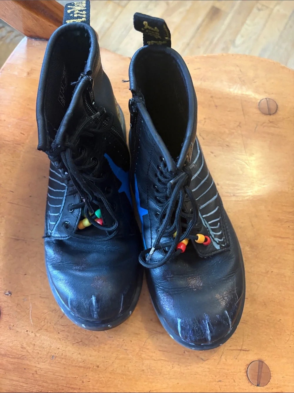 Dr. Martens Black Leather Unisex Kids Lace-Up Boots with Original Paint Artwork